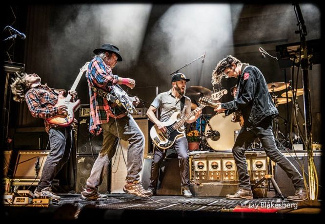 Neil Young with his new band Promise of the Real. Photo: Jay Blakesberg.