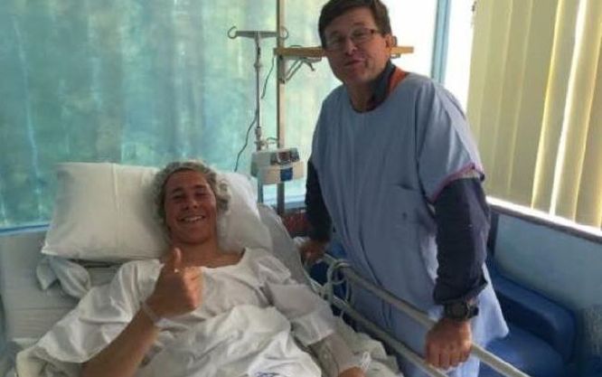 Shark attack victim Cooper Allen gives the thumbs up from his hospital bed. PHoto: Amanda Abate/Channel 7/Twitter.