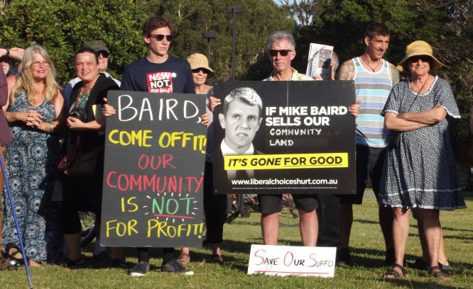 Protest signs brandished at the rally leave no doubt about the crowd's feelings.