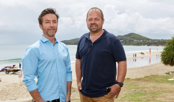 TripADeal co-founders Richard Johnston (left) and Norm Black at Byron Bay. Photo: Mark Lane.